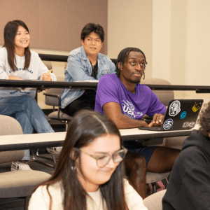 Male student listening in class